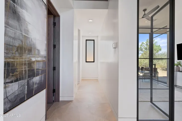 a view of a bathroom from a glass door