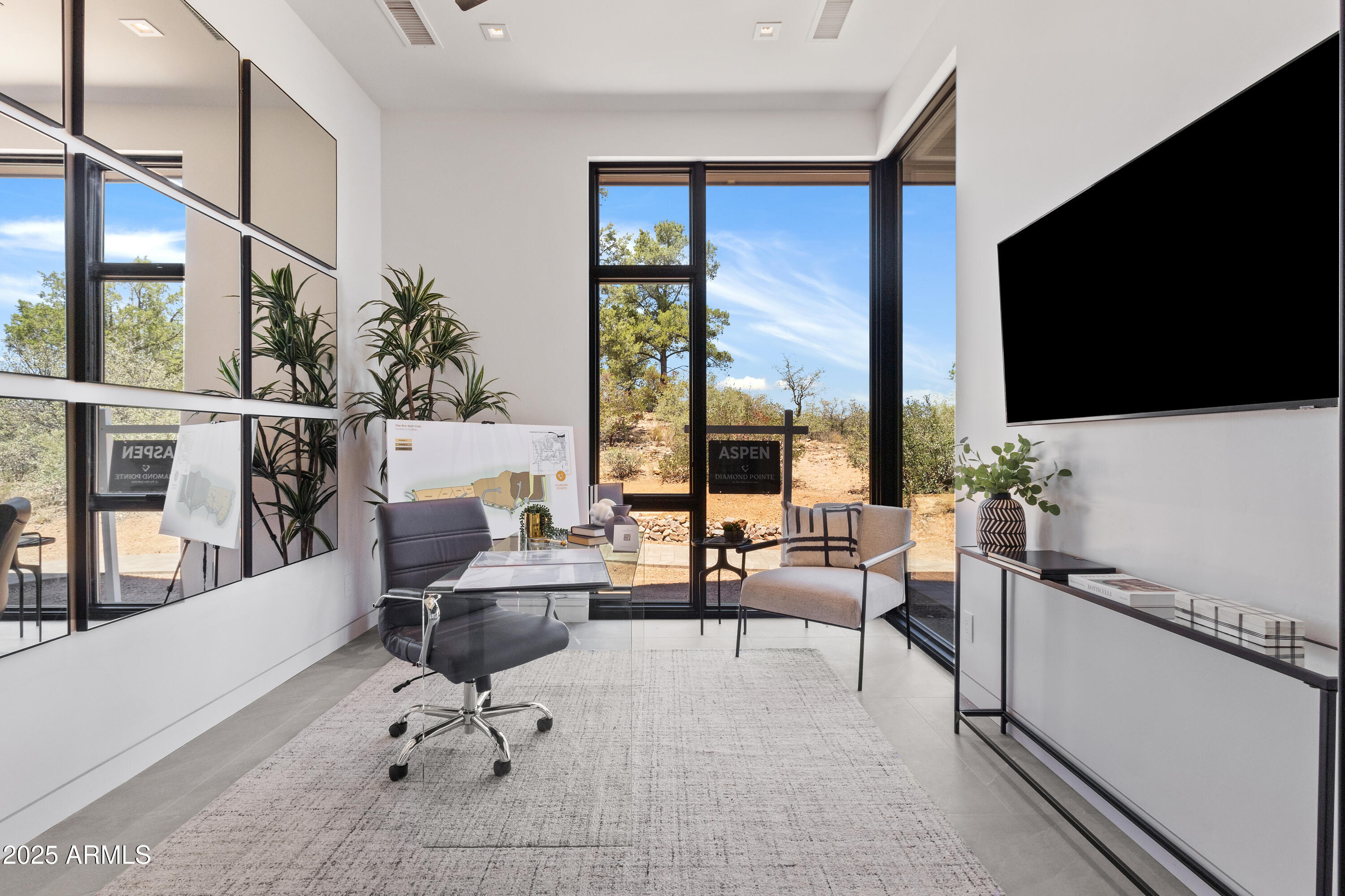 106 South Rim Club Drive Payson, AZ 85541 - Photo 25 of 49 a living room with furniture a flat screen tv and a floor to ceiling window