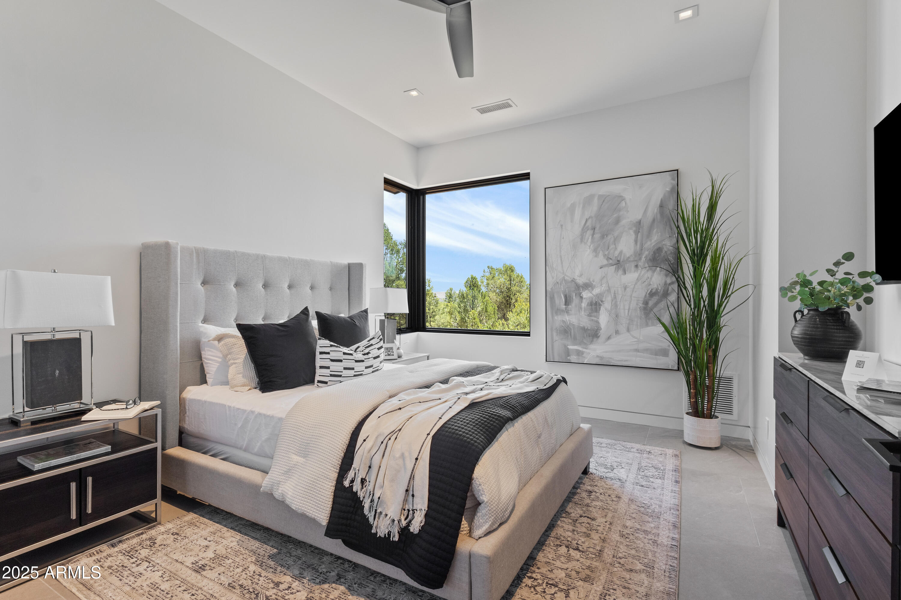 106 South Rim Club Drive Payson, AZ 85541 - Photo 28 of 49 a bedroom with bed and a potted plant