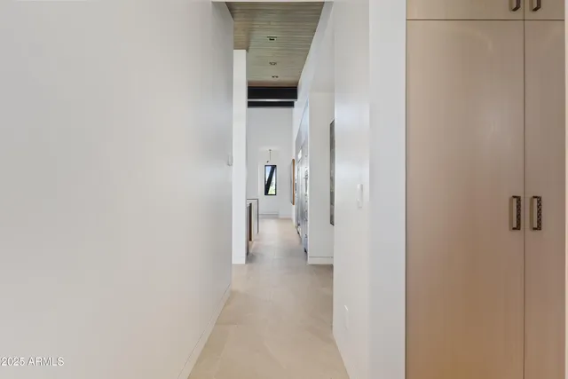 a view of a hallway with a white walls