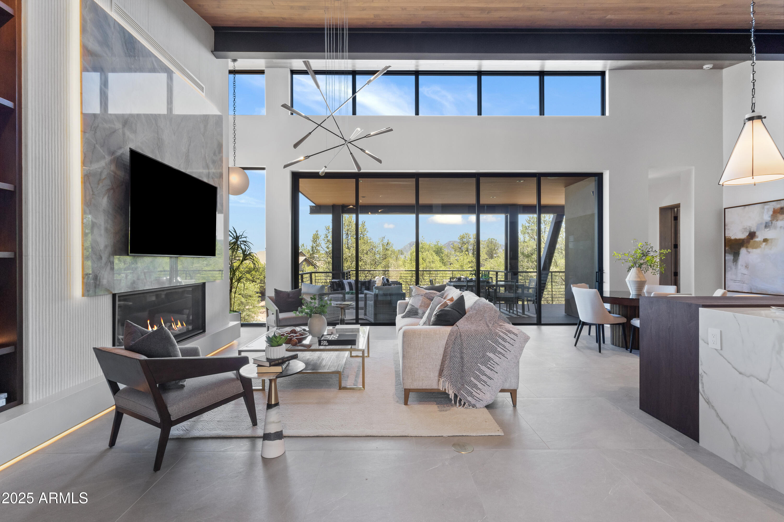 106 South Rim Club Drive Payson, AZ 85541 - Photo 6 of 49 a living room with furniture a flat screen tv and a fireplace
