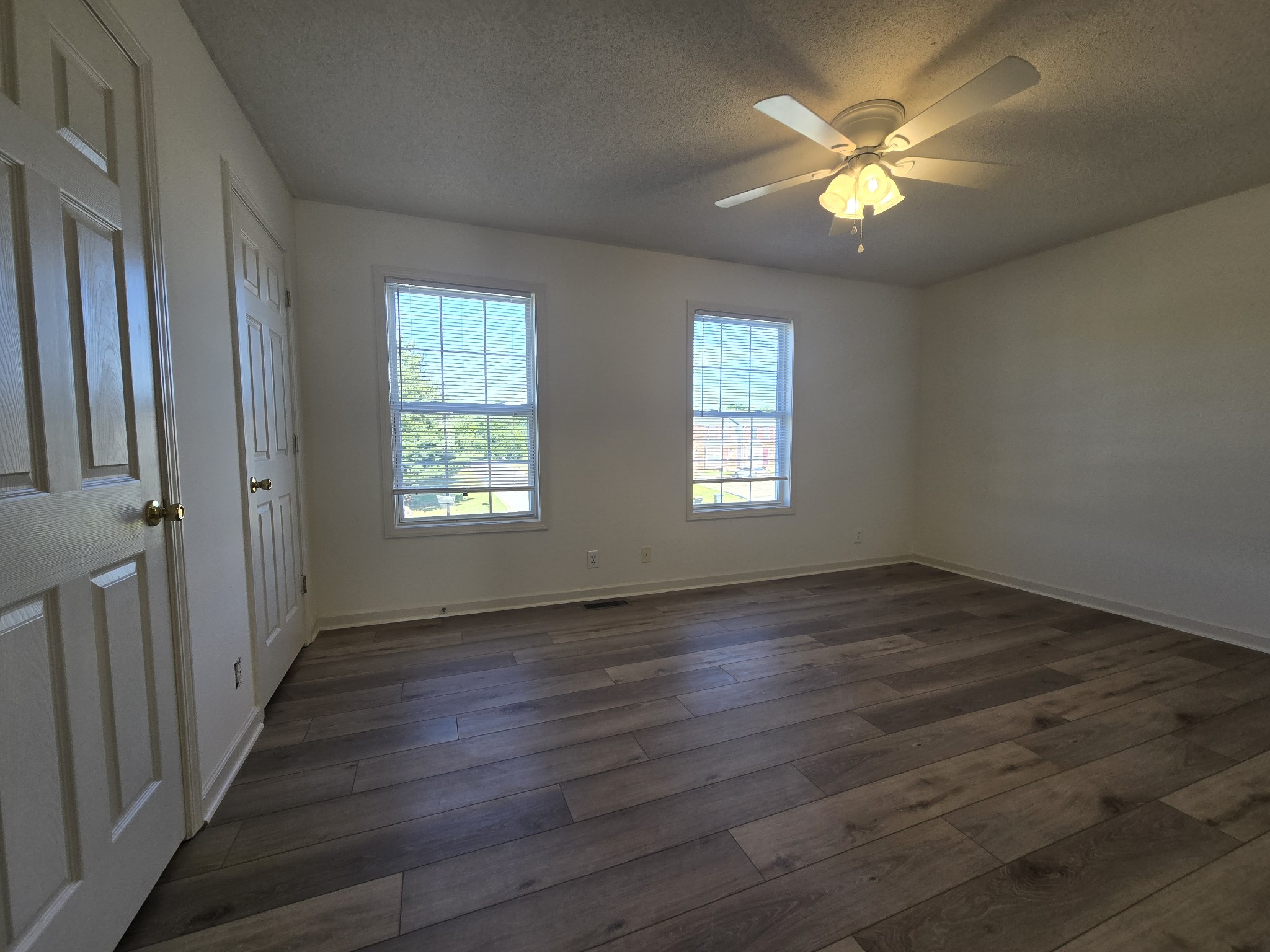 223 Tree Line Drive Oak Grove, KY 42262 - Photo 12 of 18 an empty room with wooden floor and windows