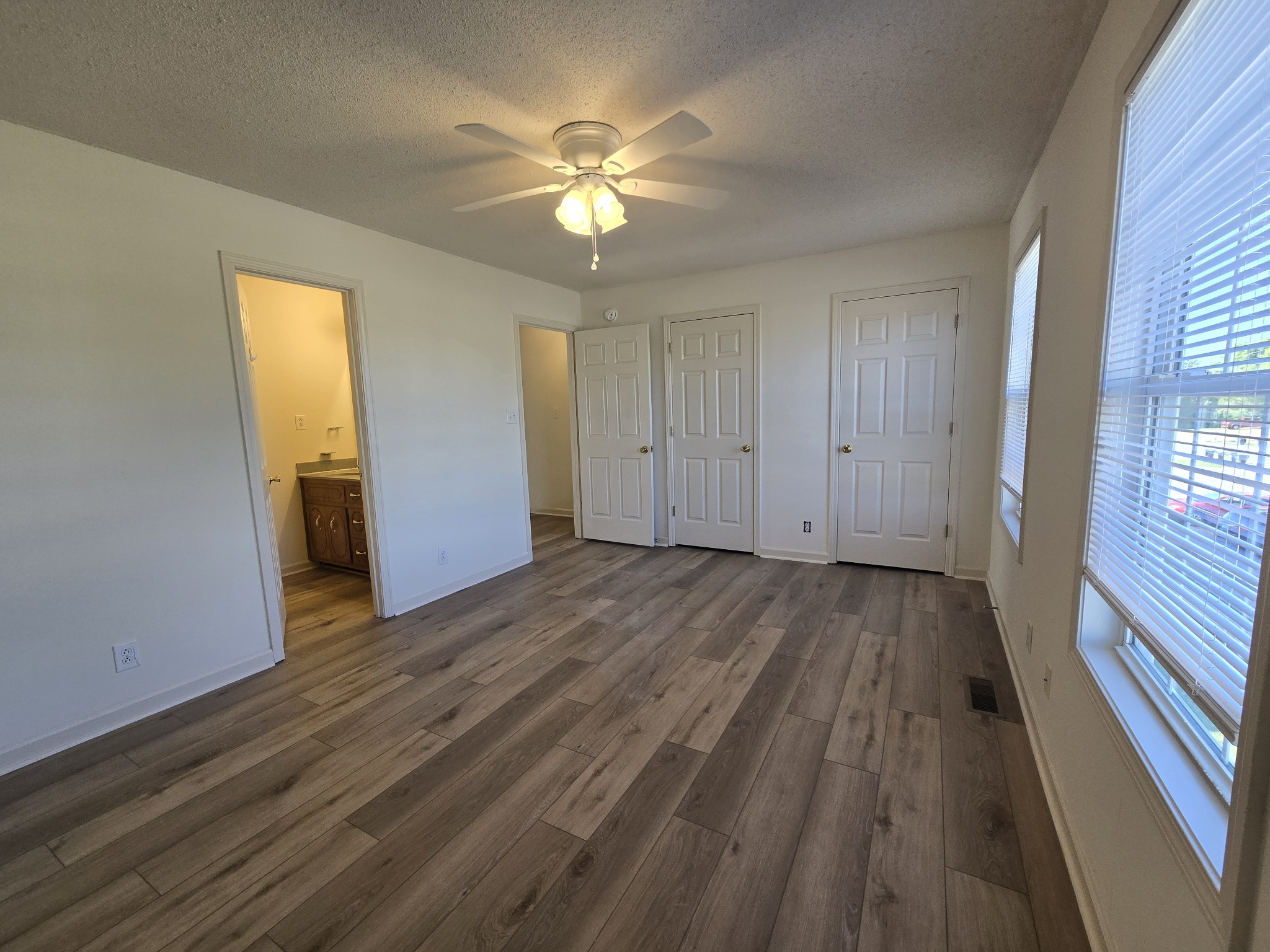 223 Tree Line Drive Oak Grove, KY 42262 - Photo 13 of 18 a view of an empty room with wooden floor and a window