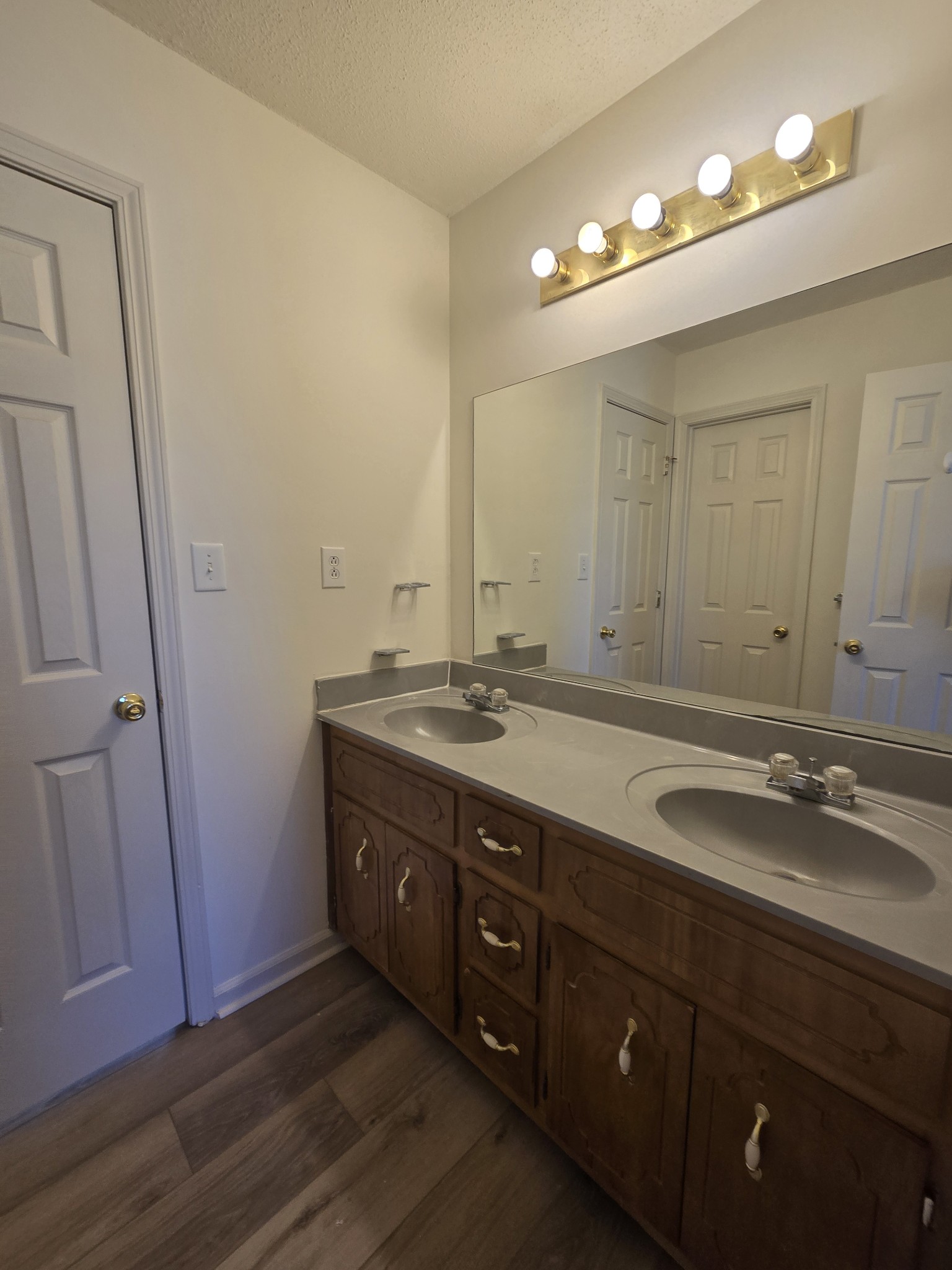 223 Tree Line Drive Oak Grove, KY 42262 - Photo 14 of 18 a bathroom with a double vanity sink and a mirror