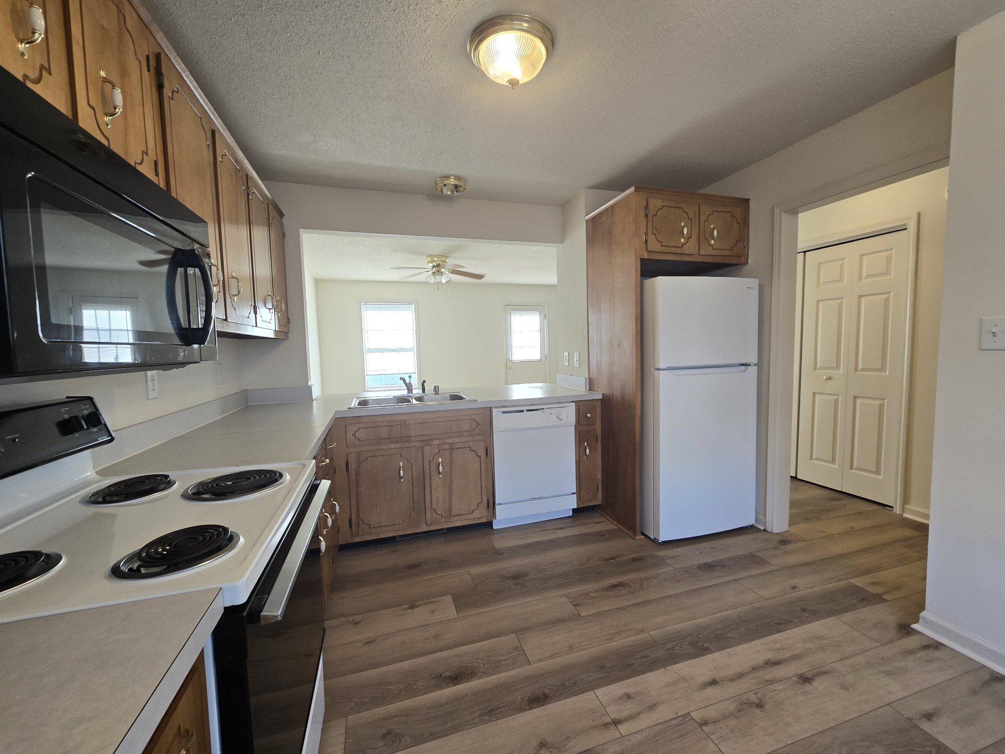 223 Tree Line Drive Oak Grove, KY 42262 - Photo 6 of 18 a kitchen with a refrigerator a stove cabinets and wooden floor