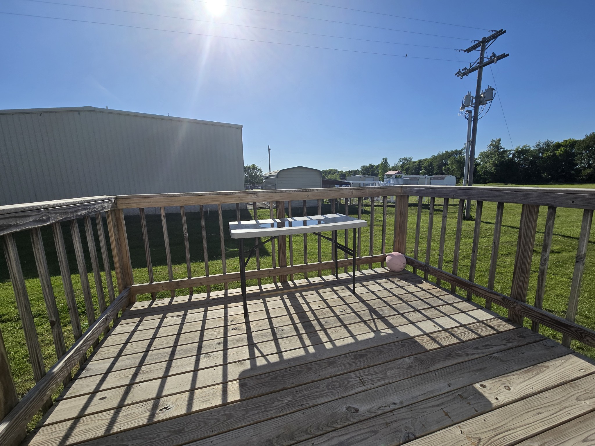 223 Tree Line Drive Oak Grove, KY 42262 - Photo 10 of 18 a view of a roof deck with two couches and wooden floor