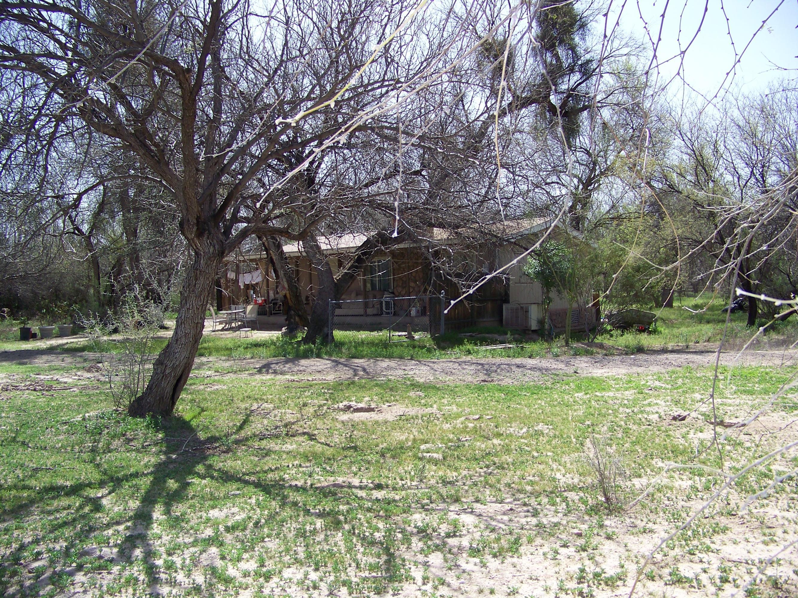 8051 East Tanque Verde Road Tucson, AZ 85749 - Photo 7 of 24 a backyard of a house with a swing and plants