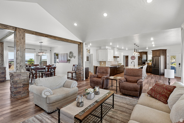 3311 West Allard Summit, UT 84772 - Photo 20 of 97 Spacious open-concept living area featuring wood-finish flooring, vaulted ceilings, and recessed lighting
