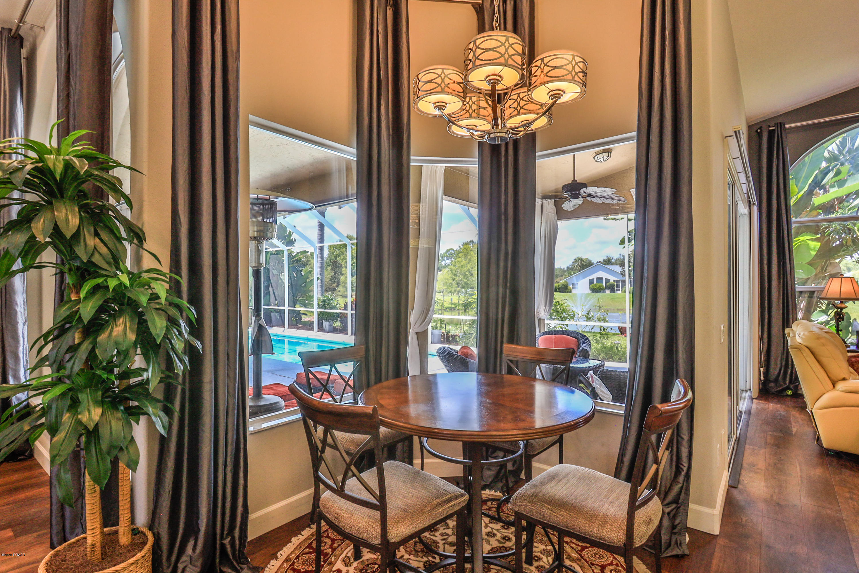5 Creek Branch Way Ormond Beach, FL 32174 - Photo 14 of 42 a view of a dining room with furniture window and wooden floor