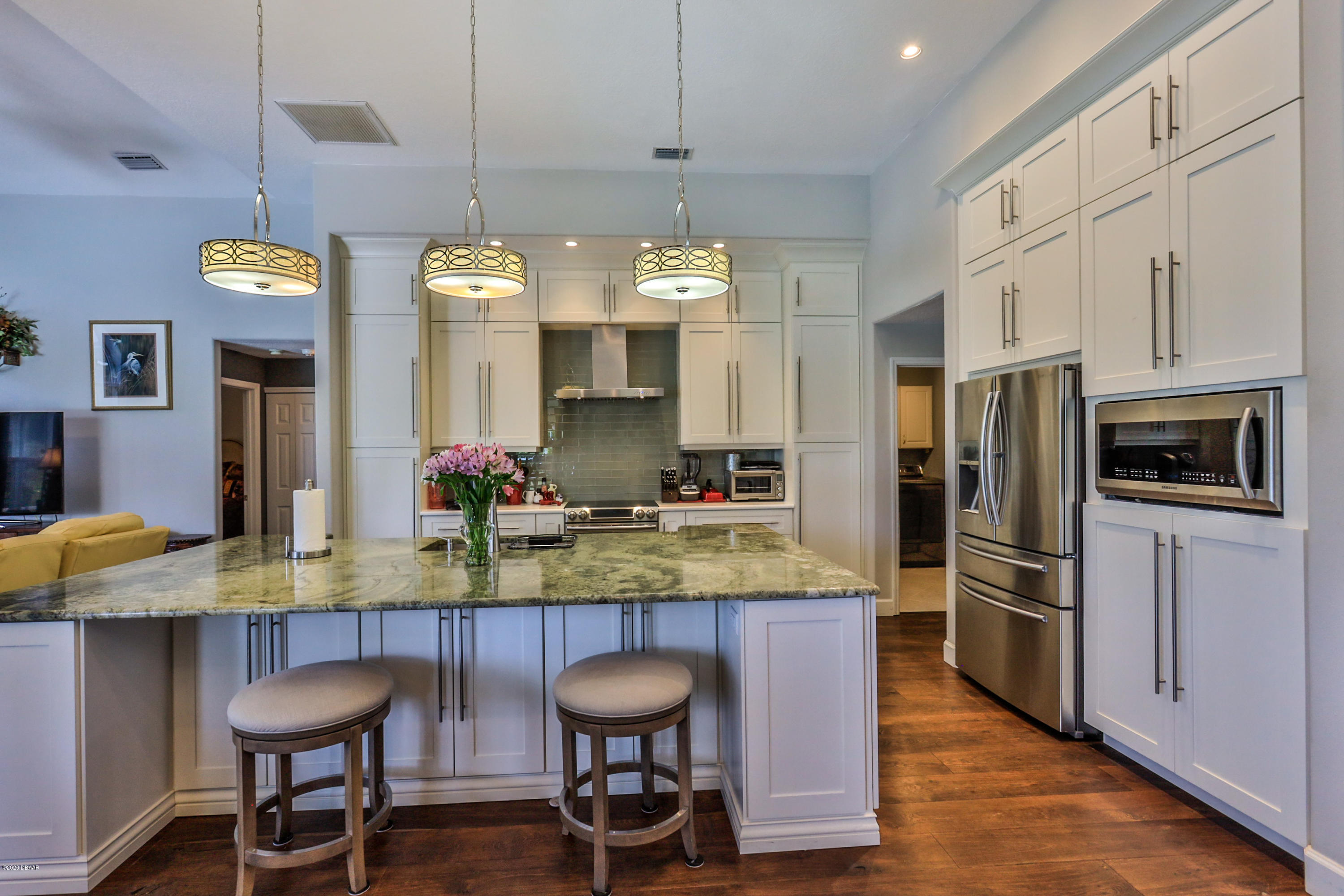 5 Creek Branch Way Ormond Beach, FL 32174 - Photo 15 of 42 a kitchen with stainless steel appliances granite countertop a sink and a refrigerator
