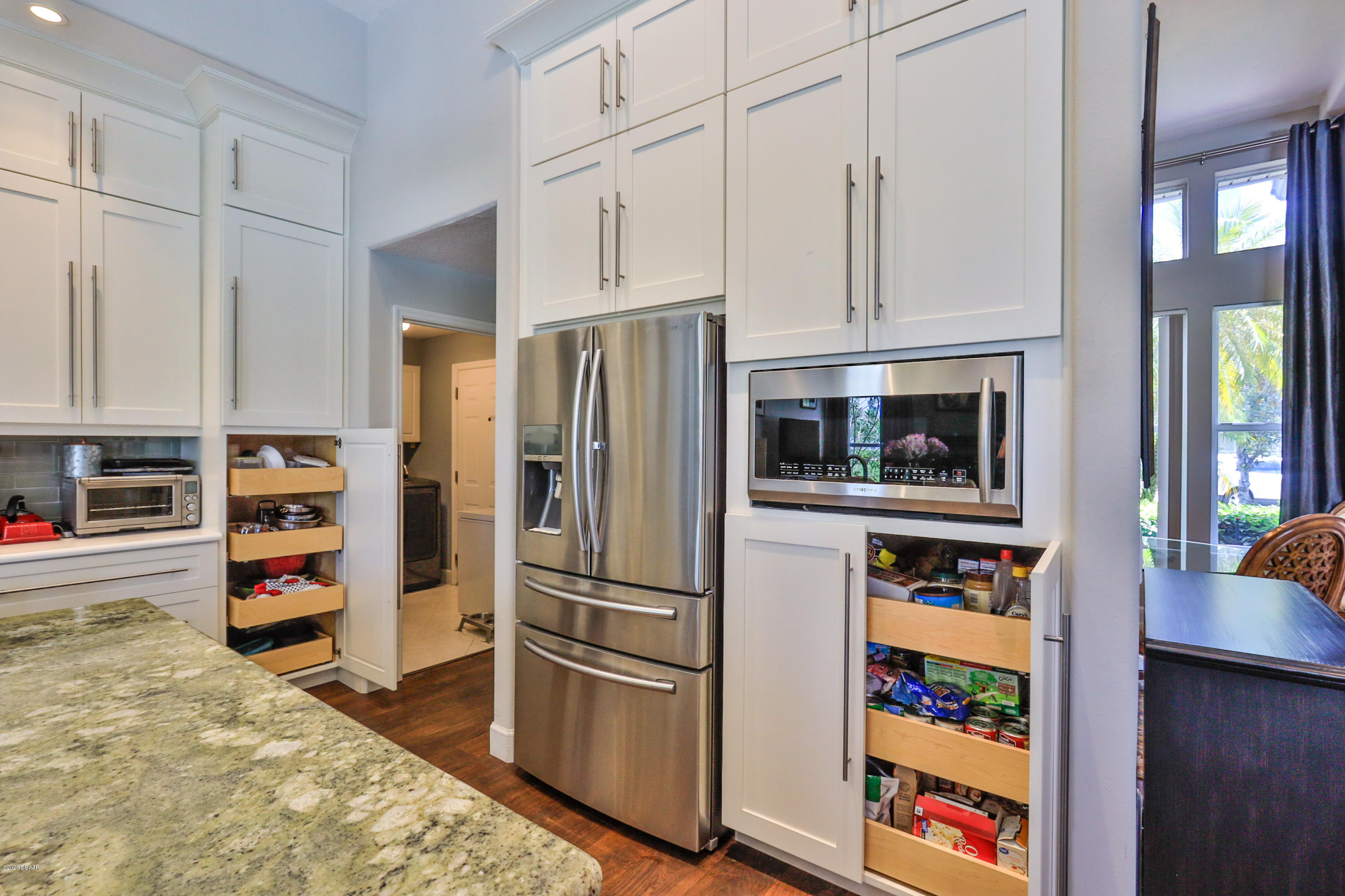 5 Creek Branch Way Ormond Beach, FL 32174 - Photo 18 of 42 a kitchen with stainless steel appliances a refrigerator and a stove top oven