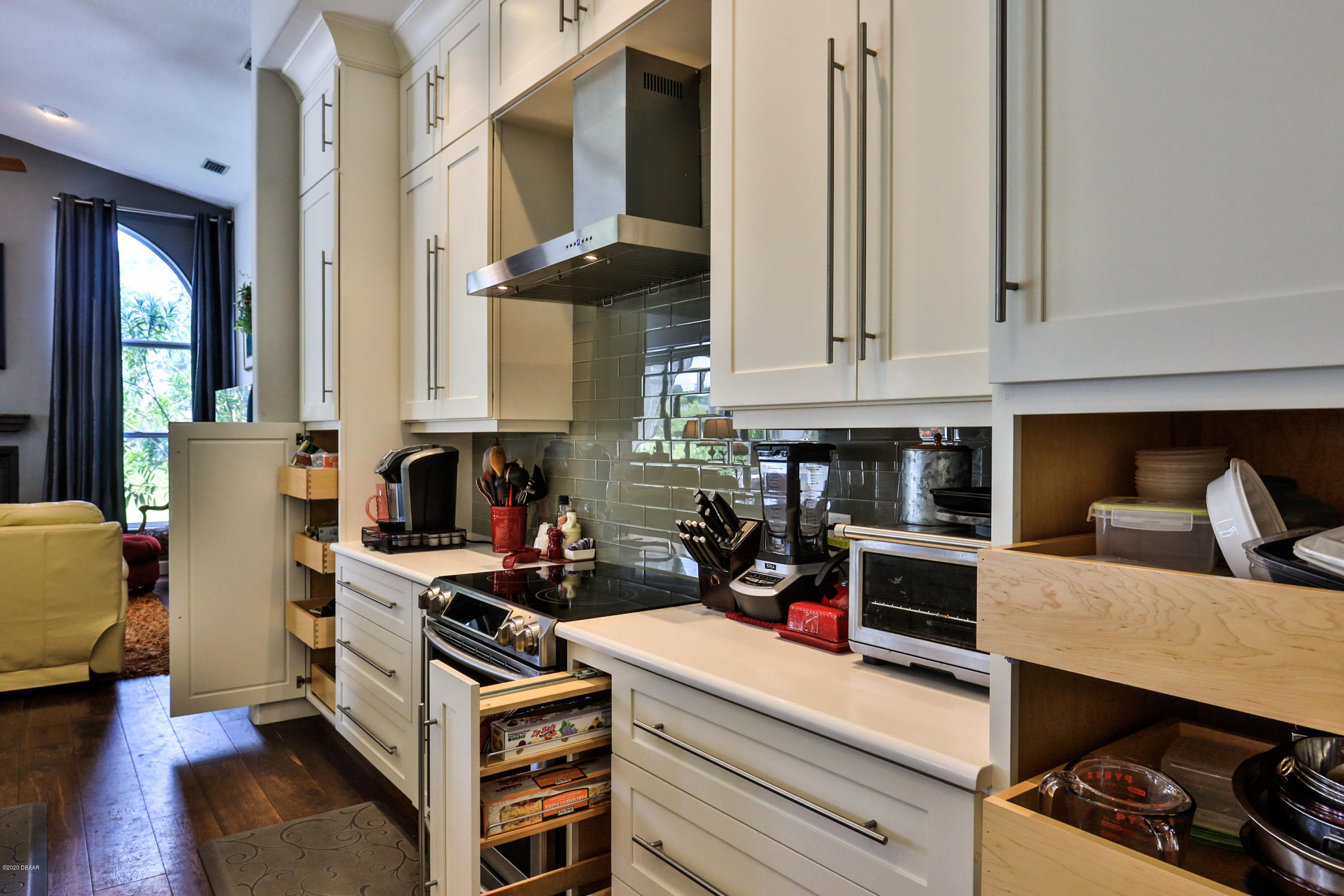 5 Creek Branch Way Ormond Beach, FL 32174 - Photo 20 of 42 a kitchen with stainless steel appliances a stove a sink and cabinets