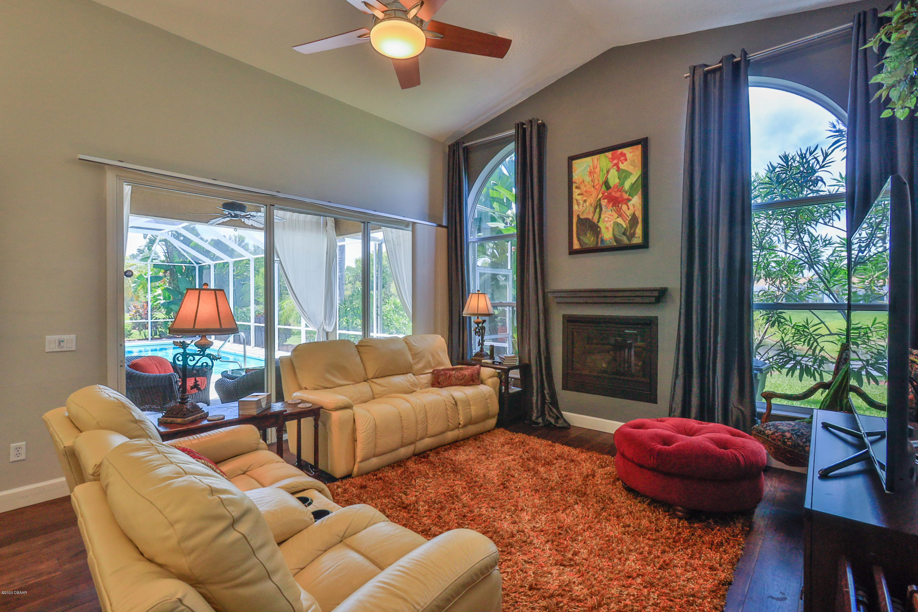 5 Creek Branch Way Ormond Beach, FL 32174 - Photo 22 of 42 a living room with furniture a fireplace and a large window