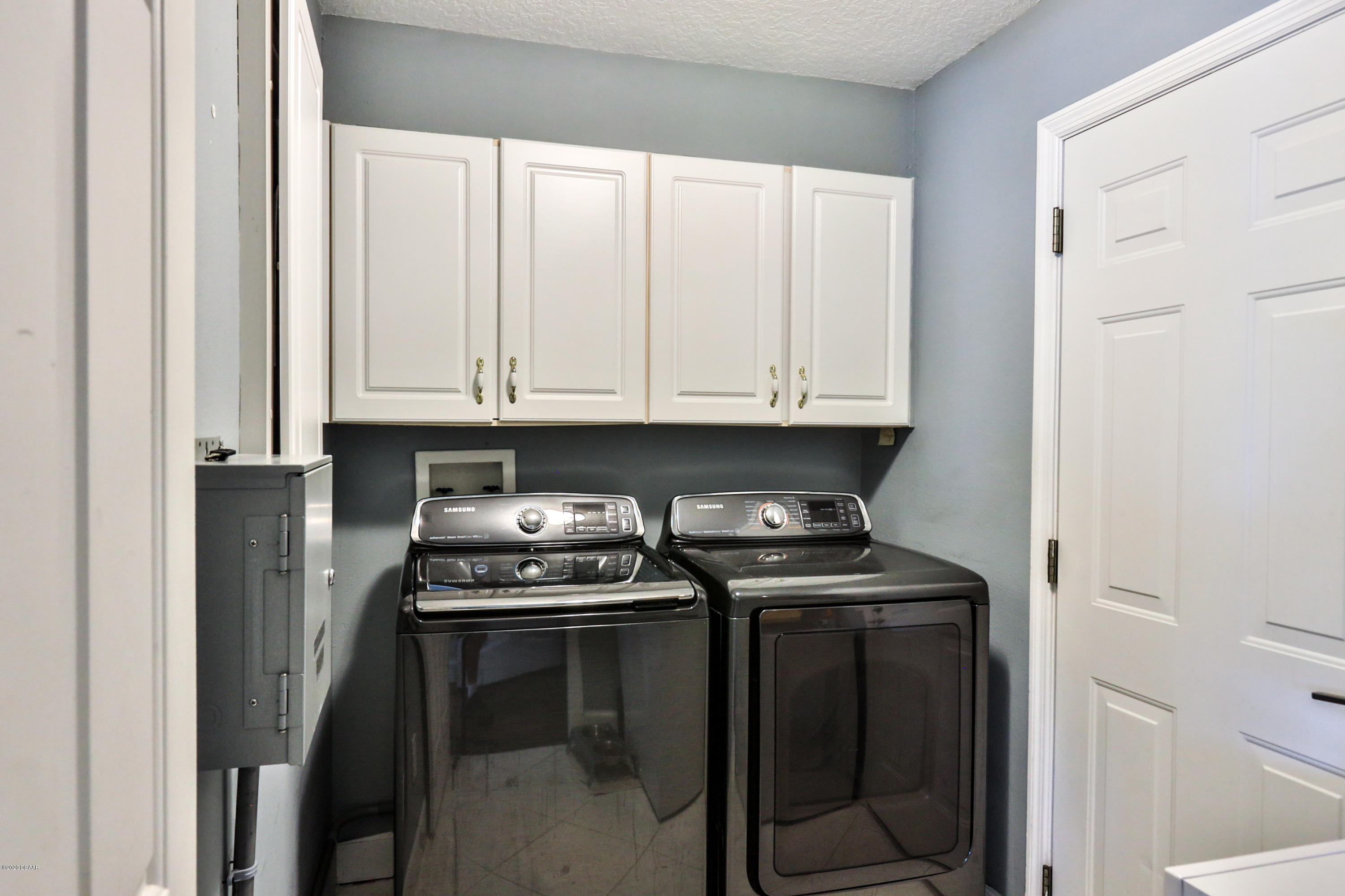 5 Creek Branch Way Ormond Beach, FL 32174 - Photo 23 of 42 a kitchen with granite countertop a stove top oven and cabinets