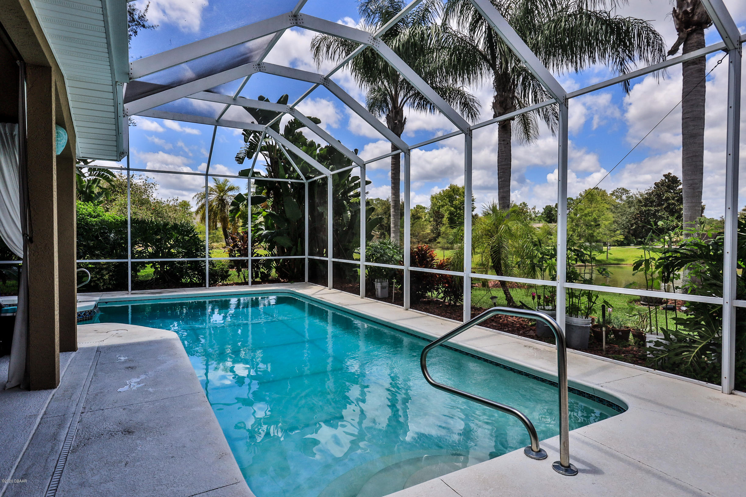 5 Creek Branch Way Ormond Beach, FL 32174 - Photo 30 of 42 a view of a swimming pool with a porch