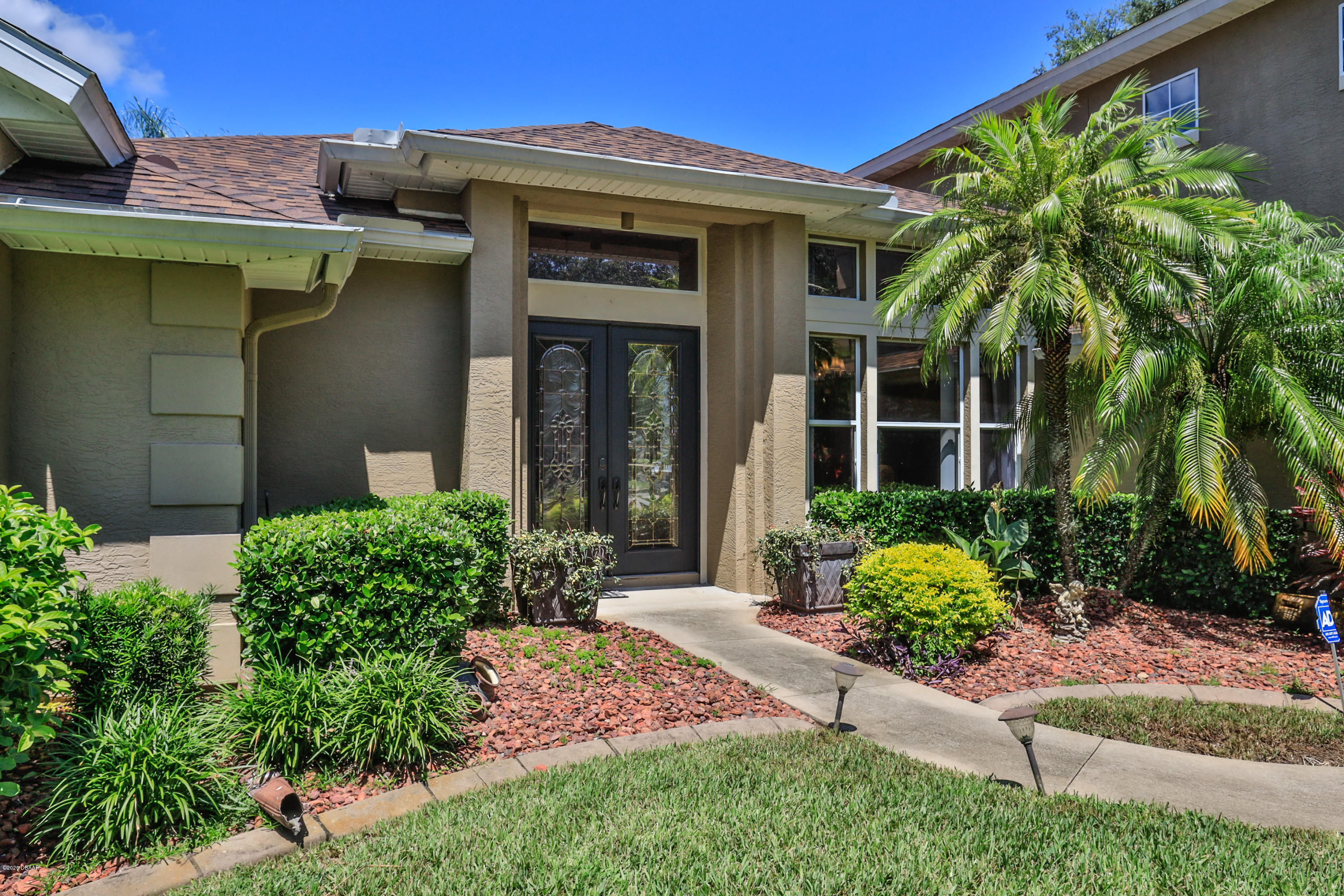 5 Creek Branch Way Ormond Beach, FL 32174 - Photo 3 of 42 a front view of a house with a yard