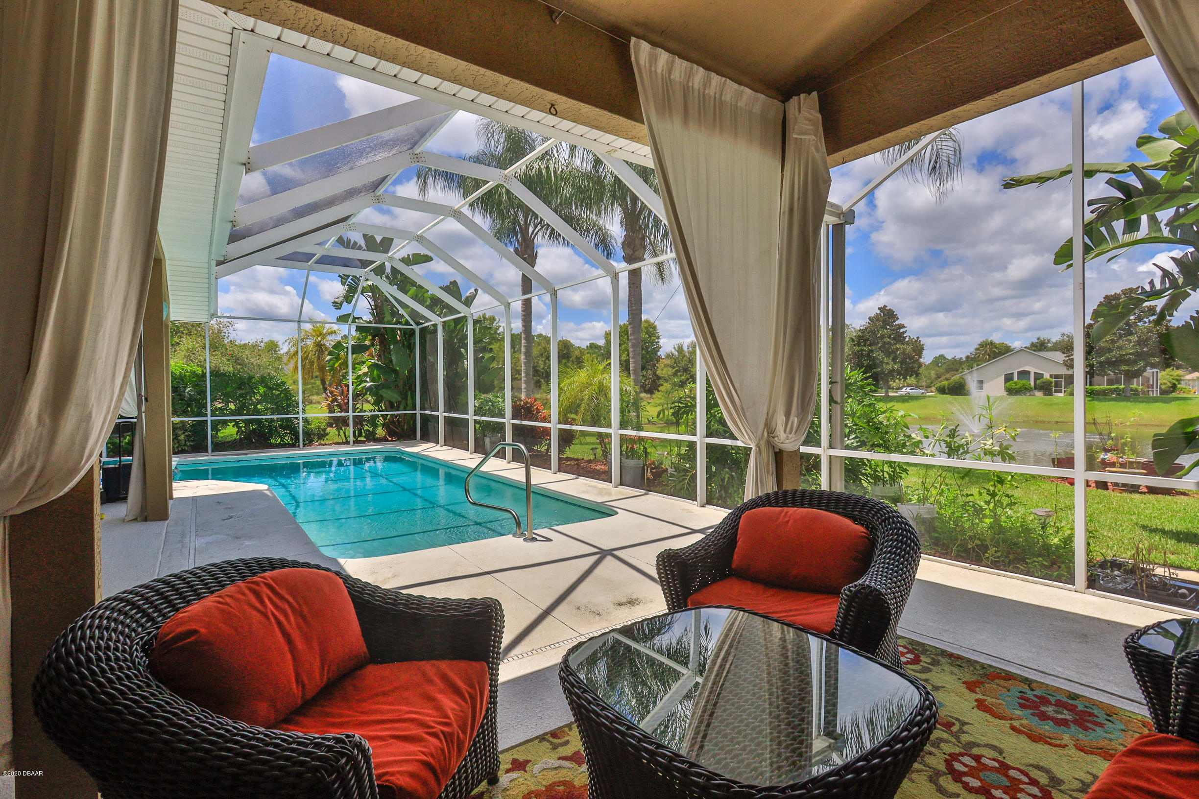 5 Creek Branch Way Ormond Beach, FL 32174 - Photo 31 of 42 a outdoor living space with patio furniture and a floor to ceiling window