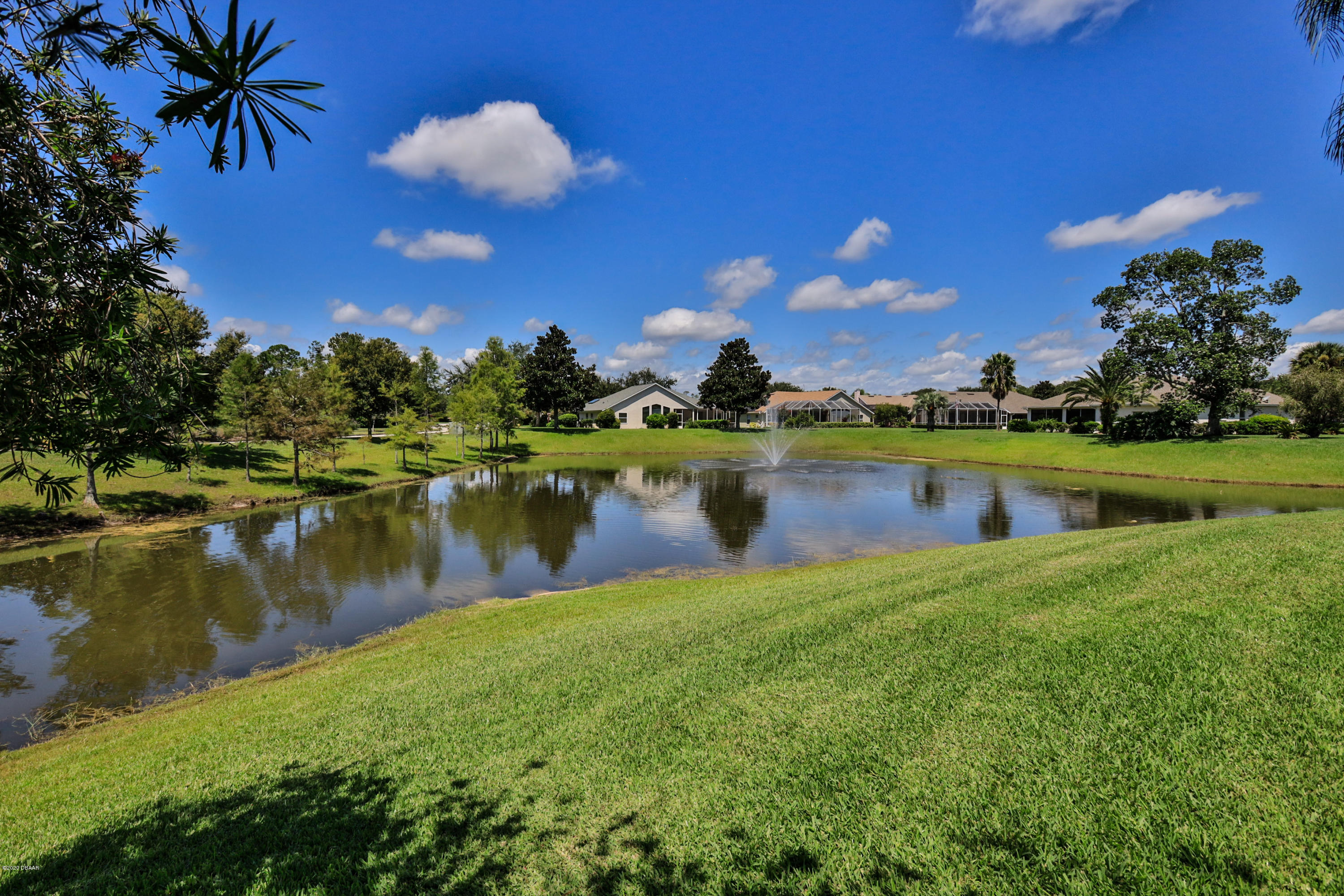 5 Creek Branch Way Ormond Beach, FL 32174 - Photo 37 of 42 a view of a lake with a house in the background