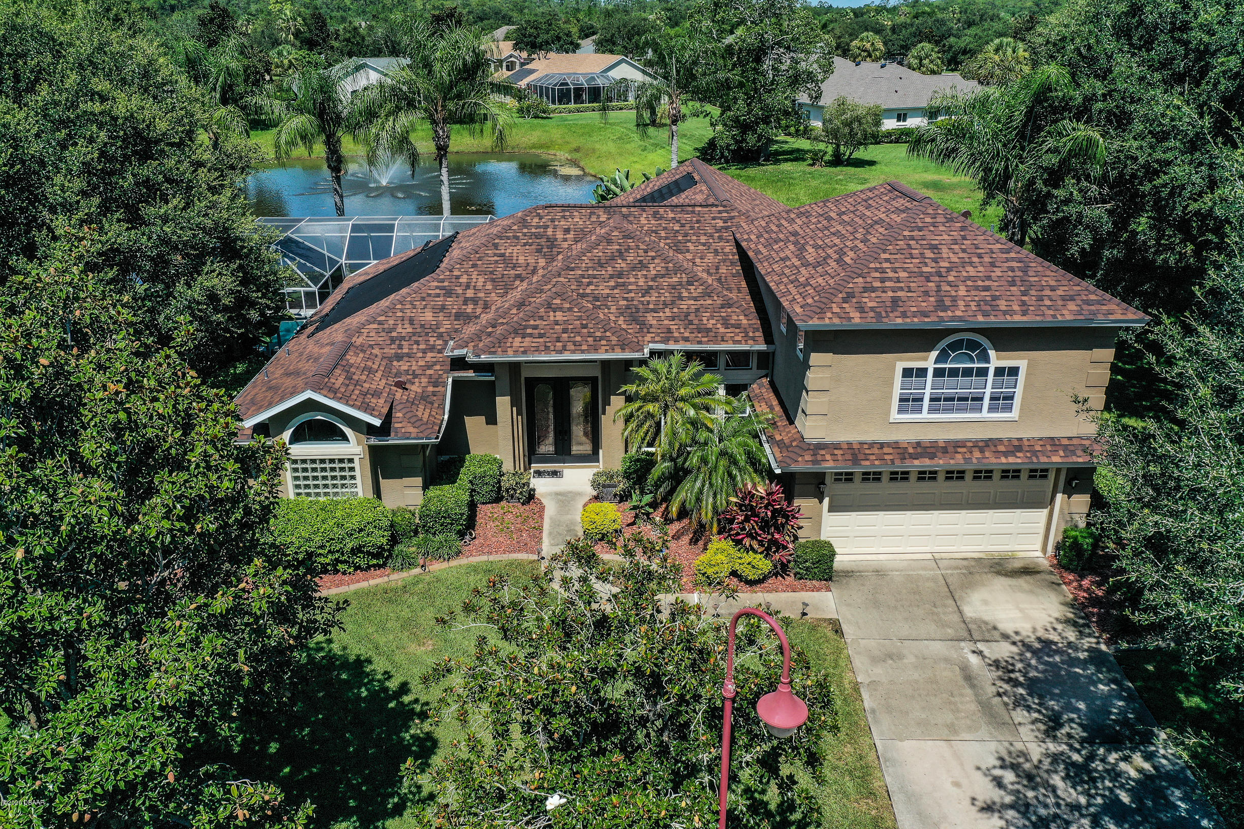 5 Creek Branch Way Ormond Beach, FL 32174 - Photo 5 of 42 a aerial view of a house with a yard and potted plants