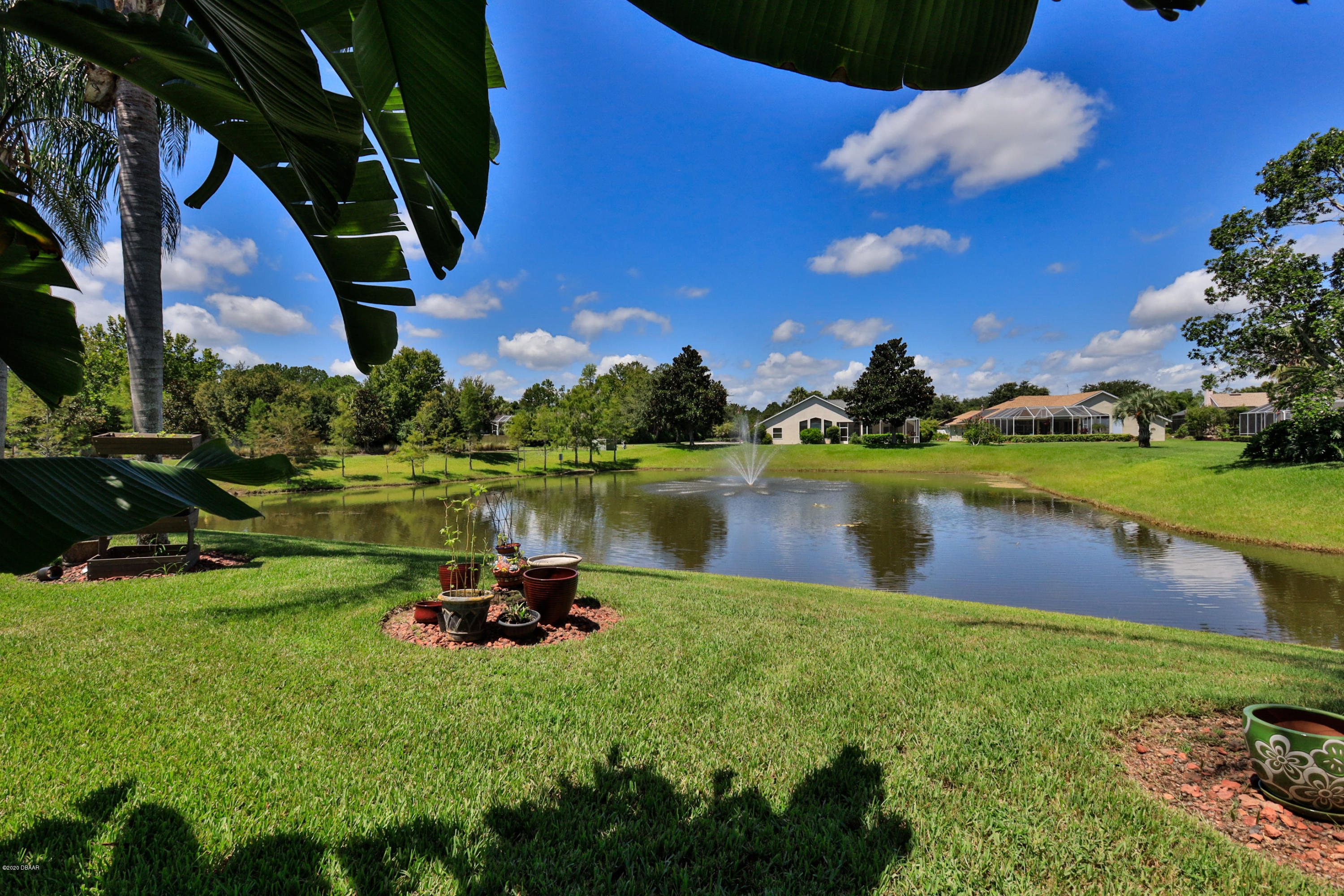 5 Creek Branch Way Ormond Beach, FL 32174 - Photo 7 of 42 a lake view with a garden