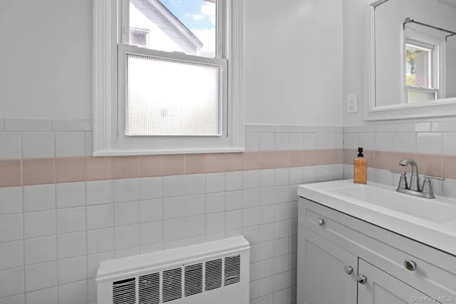 a bathroom with a sink and a window