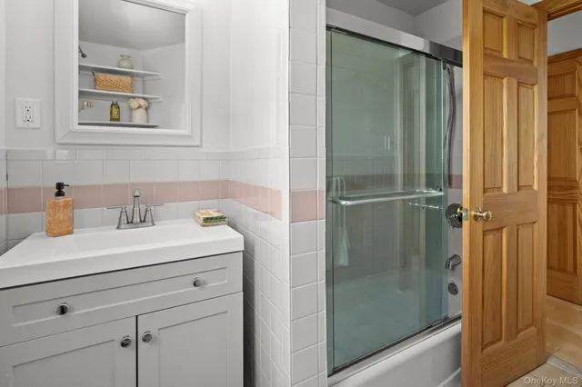 a bathroom with a sink and mirror