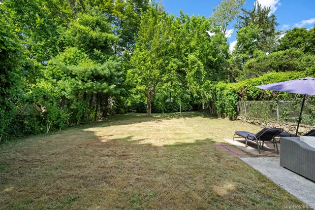 a view of a backyard with a patio