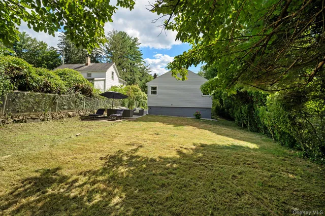 a view of a swimming pool with an outdoor space and seating area