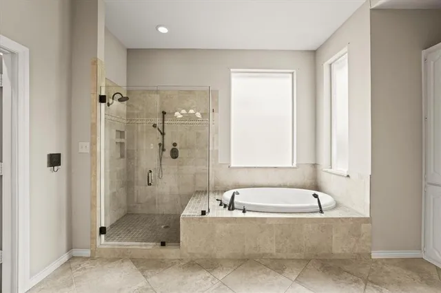 a kitchen with stainless steel appliances a stove a refrigerator and a sink