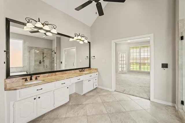a kitchen with stainless steel appliances granite countertop a refrigerator a stove and a sink