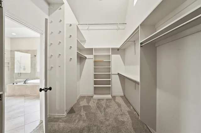 a kitchen with a stove a sink and a window