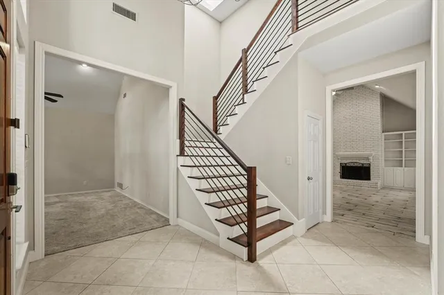a view of a hallway with entryway and hall