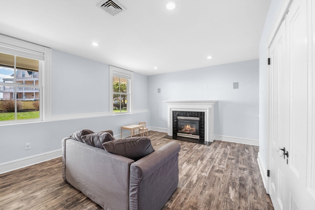 90 Puritan Road Swampscott, MA 01907 - Photo 33 of 42 a living room with furniture and a fireplace