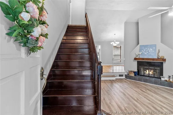a view of entryway and hall with wooden floor