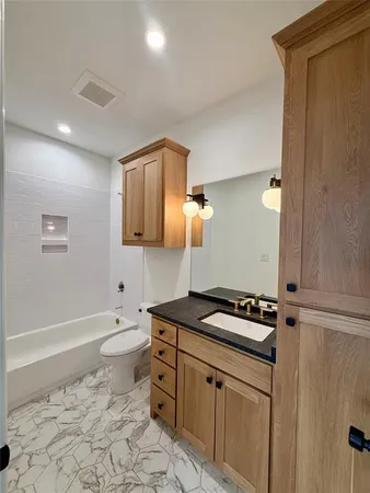 a view of a kitchen with cabinets