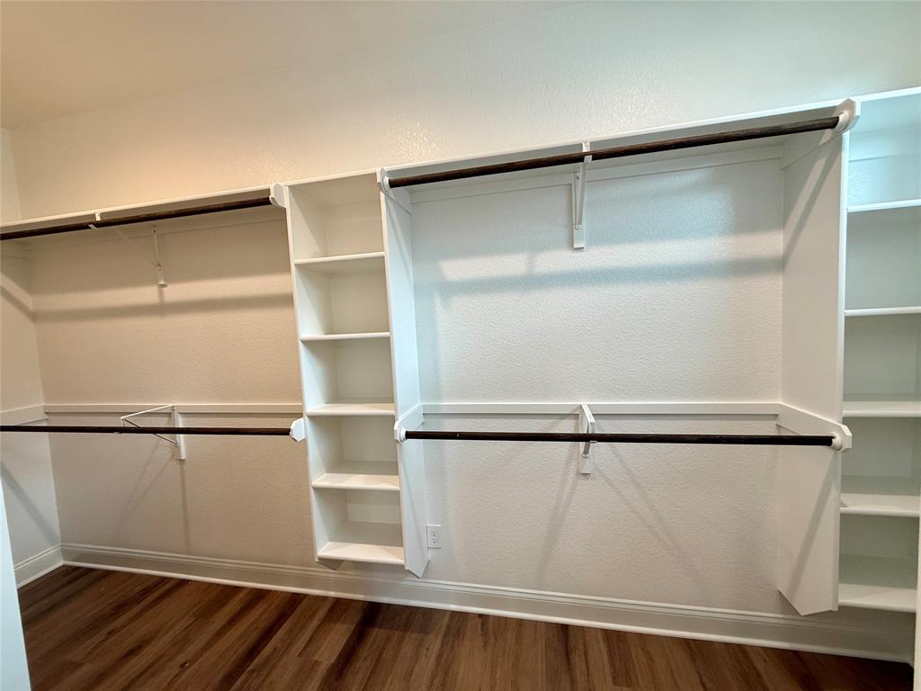 10400 T T Bury Lane Waco, TX 76708 - Photo 18 of 22 a view of walk in closet with empty racks