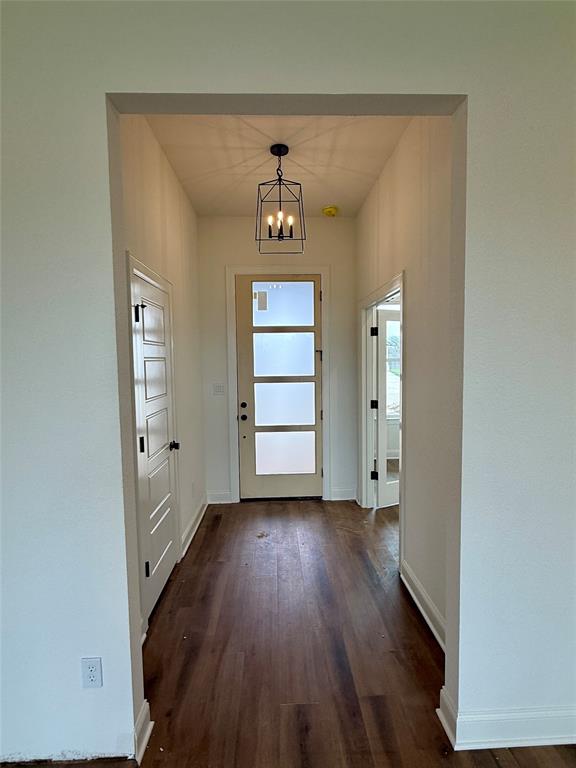 10400 T T Bury Lane Waco, TX 76708 - Photo 2 of 22 wooden floor in an empty room with a window