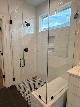 a bathroom with 2 sink and a mirror