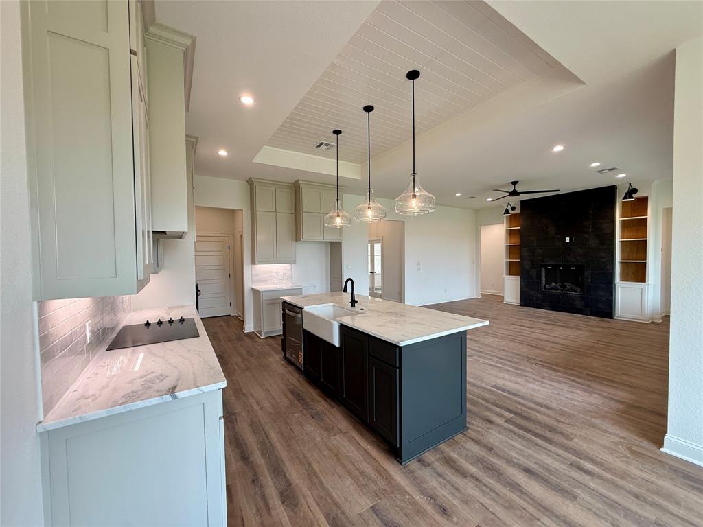 10400 T T Bury Lane Waco, TX 76708 - Photo 22 of 22 a large kitchen with stainless steel appliances kitchen island a large island in the center