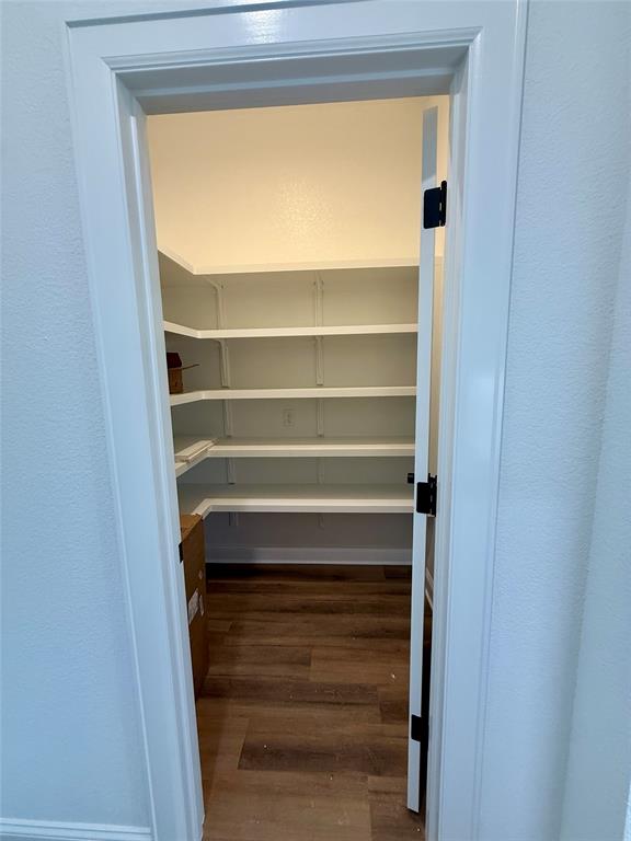 10400 T T Bury Lane Waco, TX 76708 - Photo 6 of 22 a view of walk in closet with empty racks