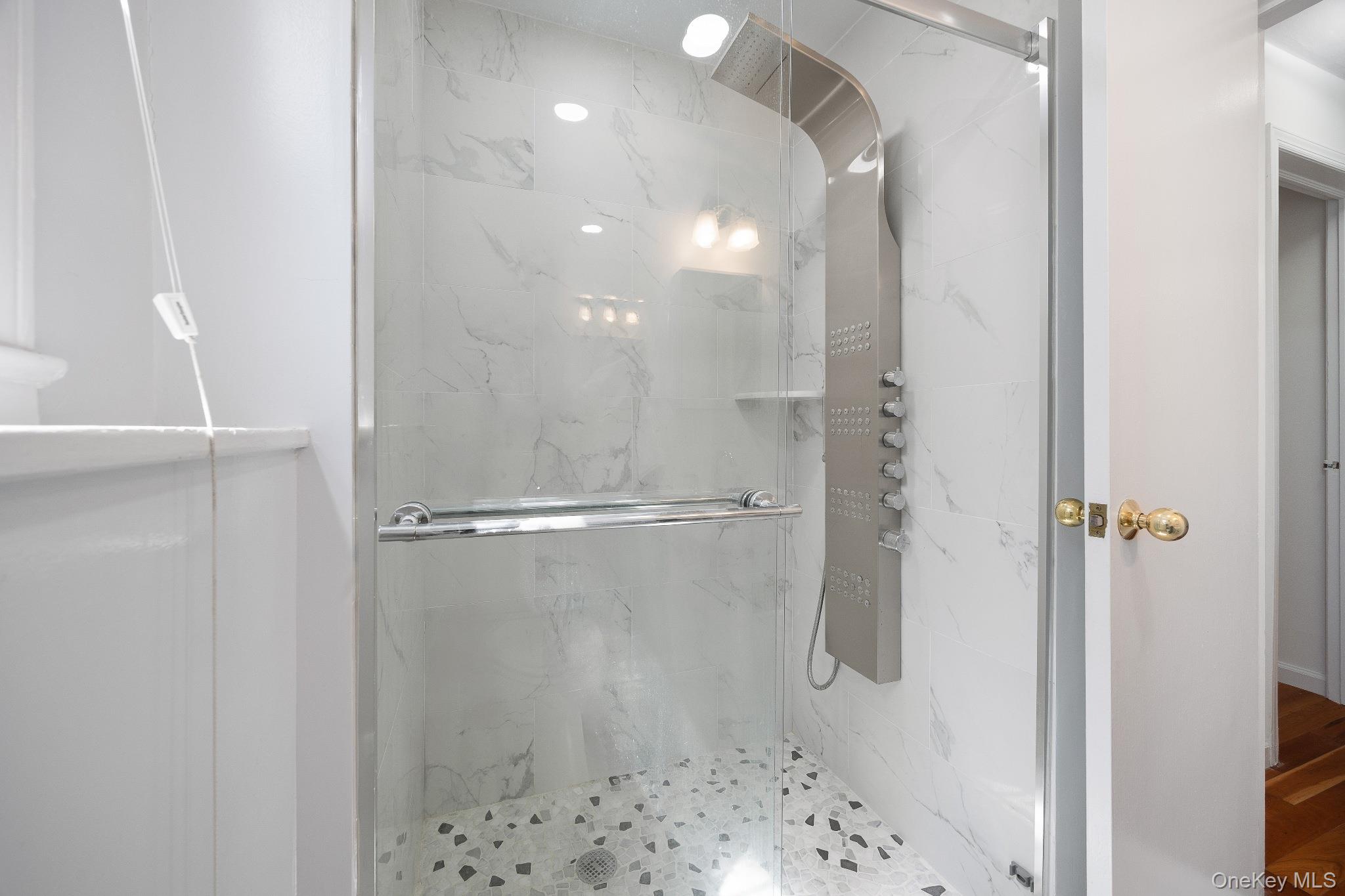 372 Heathcote Road Scarsdale, NY 10583 - Photo 10 of 20 Bathroom featuring a marble finish shower