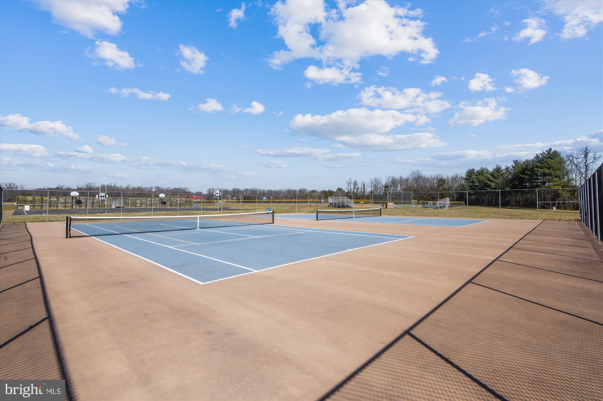 292 Colebrook Road Fredericksburg, VA 22405 - Photo 63 of 67 Sunny tennis courts under a bright blue sky.