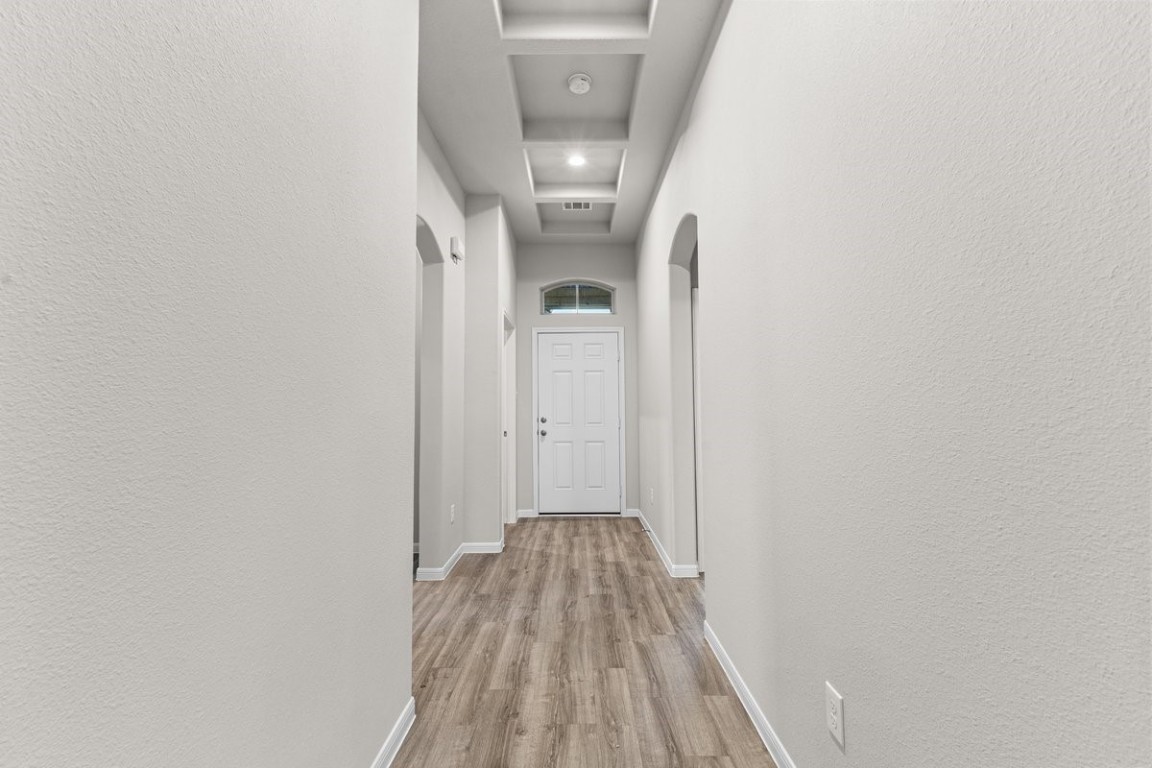 10139 Red Snapper Road Magnolia, TX 77354 - Photo 4 of 27 a view of a hallway with wooden floor