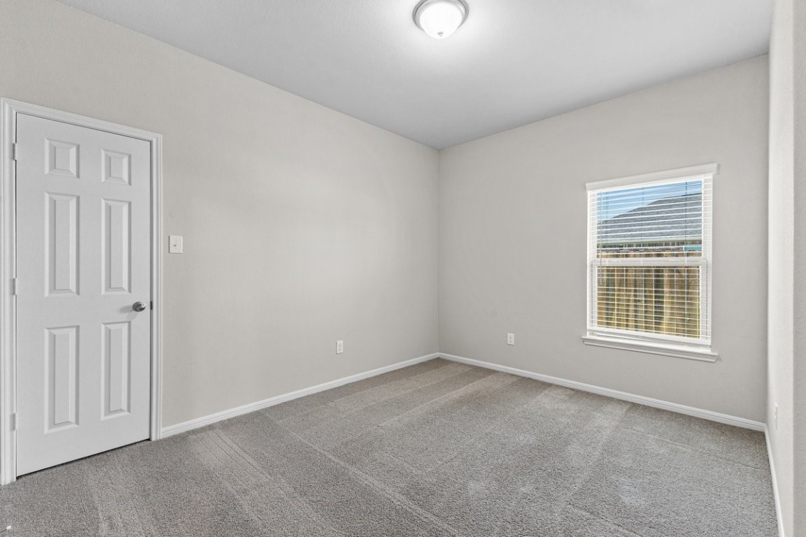 10139 Red Snapper Road Magnolia, TX 77354 - Photo 5 of 27 an empty room with a window