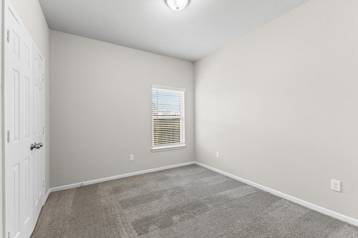 10139 Red Snapper Road Magnolia, TX 77354 - Photo 7 of 27 a view of an empty room with a window