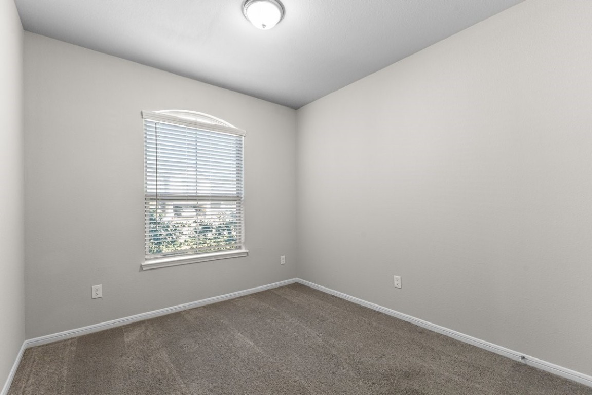 10139 Red Snapper Road Magnolia, TX 77354 - Photo 9 of 27 an empty room with a window
