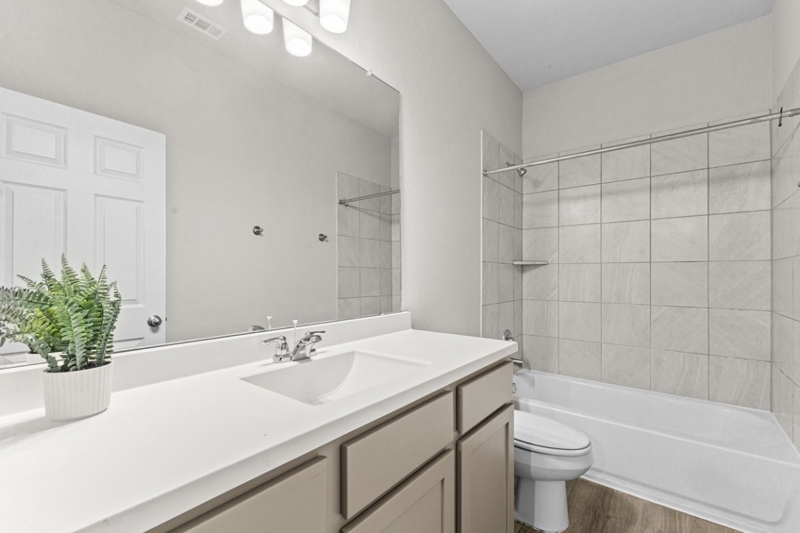 10139 Red Snapper Road Magnolia, TX 77354 - Photo 10 of 27 a bathroom with a sink toilet and shower