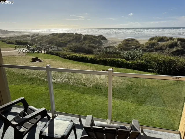 a view of a balcony with lake view and mountain view