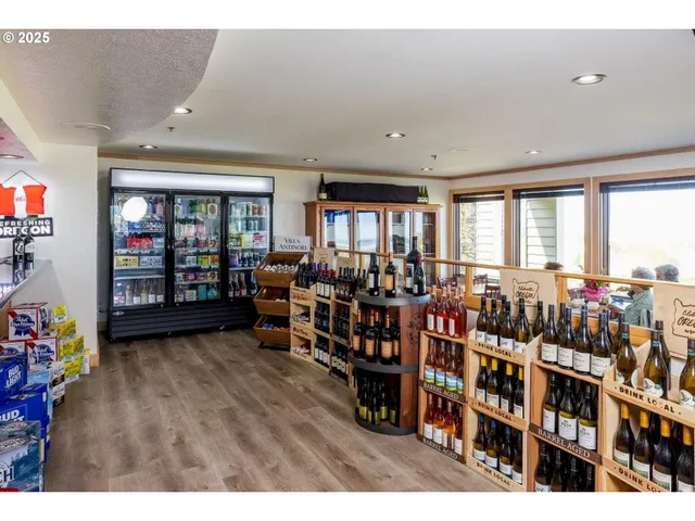 a room with lots of wooden furniture and windows