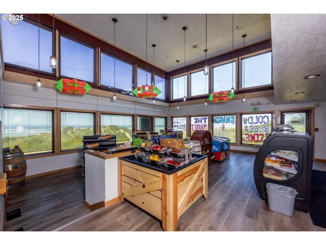 a kitchen view of a that has a stove and a wooden floor